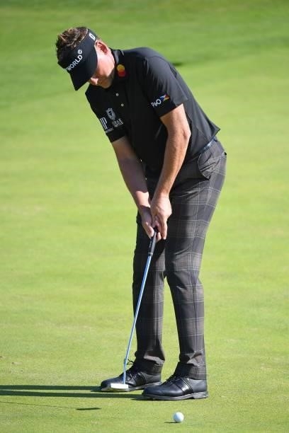 England's Ian Poulter putts on the 6th green during his first round on day one of The 149th British Open Golf Championship at Royal St George's,...