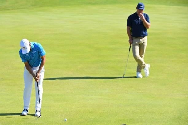 England's Paul Casey looks on as Mexico's Abraham Ancer putts on the 6th green during his first round on day one of The 149th British Open Golf...