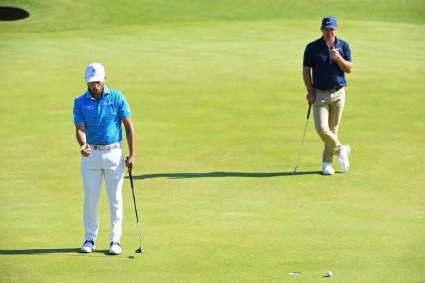 England's Paul Casey looks on as Mexico's Abraham Ancer reacts to missing a birdie putt on the 6th green during his first round on day one of The...