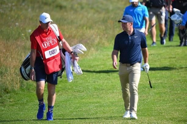 England's Paul Casey and caddie John McLaren walk to the 6th green during their first round on day one of The 149th British Open Golf Championship at...