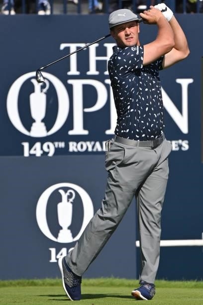 Golfer Bryson DeChambeau watches his iron shot from the 1st tee during his first round on day one of The 149th British Open Golf Championship at...
