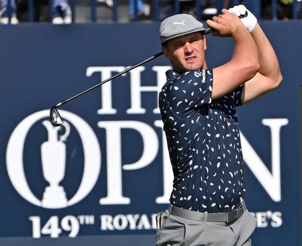 Golfer Bryson DeChambeau watches his iron shot from the 1st tee during his first round on day one of The 149th British Open Golf Championship at...