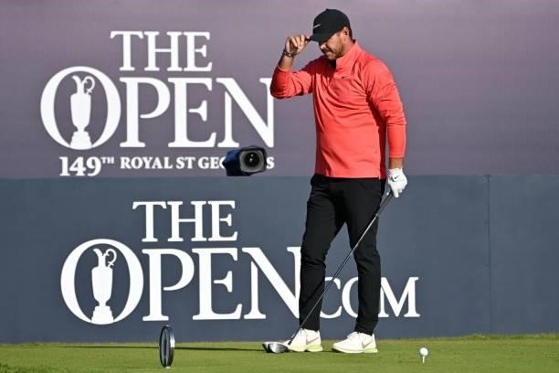 Golfer Brooks Koepka acknolwledges the crowd as he arrives on the 1st tee ahead of his first round on day one of The 149th British Open Golf...