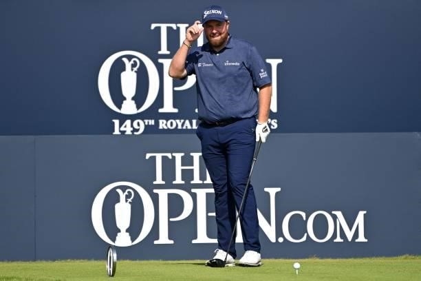 Ireland's Shane Lowry acknowledges the crowd as he arrives on the 1st tee ahead of his first round on day one of The 149th British Open Golf...