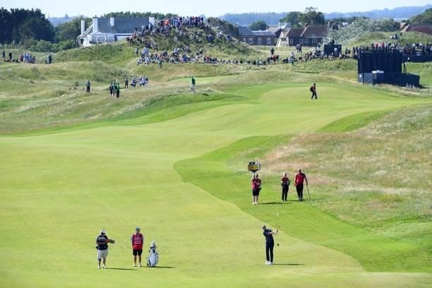 Golfer Daniel Berger plays his approach shot from the 7th fairway during his first round on day one of The 149th British Open Golf Championship at...