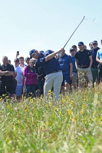 South Africa's Branden Grace plays from the rough on the 7th hole during his first round on day one of The 149th British Open Golf Championship at...