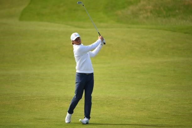 England's amateur golfer Joe Long watches his approach shot from the 7th fairway during his first round on day one of The 149th British Open Golf...