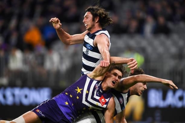 Jack Henry of the Cats spoils in a marking contest during the 2021 AFL Round 18 match between the Fremantle Dockers and the Geelong Cats at Optus...