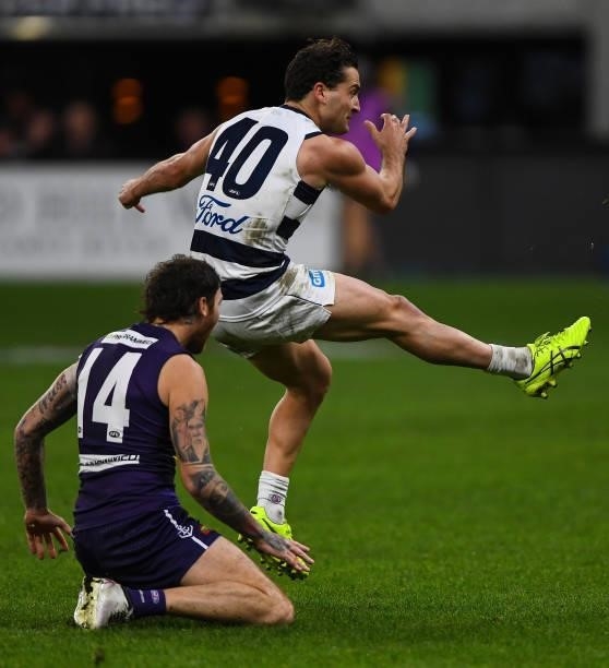 Luke Dahlhaus of the Cats kicks on goal during the 2021 AFL Round 18 match between the Fremantle Dockers and the Geelong Cats at Optus Stadium on...