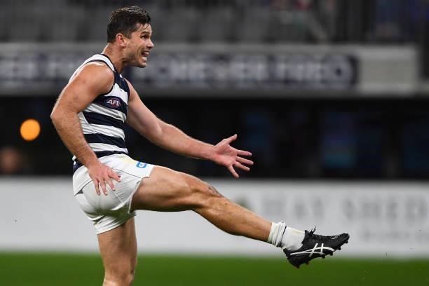 Tom Hawkins of the Cats kicks on goal during the 2021 AFL Round 18 match between the Fremantle Dockers and the Geelong Cats at Optus Stadium on July...