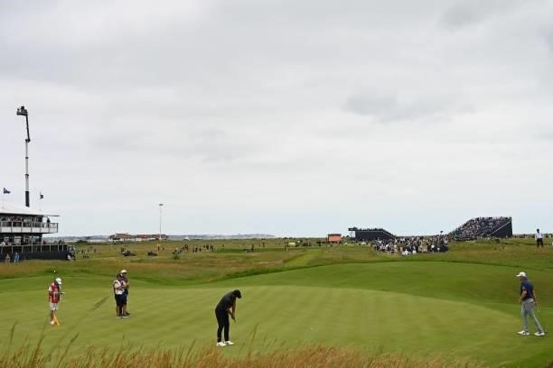 Golfer Brooks Koepka putts on the 16th green during his first round on day one of The 149th British Open Golf Championship at Royal St George's,...