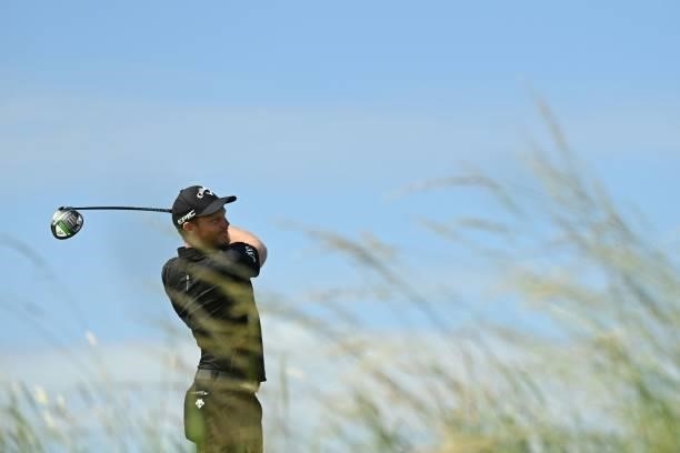 England's Danny Willett watches his drive from the 13th tee during his first round on day one of The 149th British Open Golf Championship at Royal St...