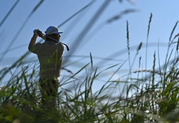 Golfer Chan Kim watches his drive from the 10th tee during his first round on day one of The 149th British Open Golf Championship at Royal St...