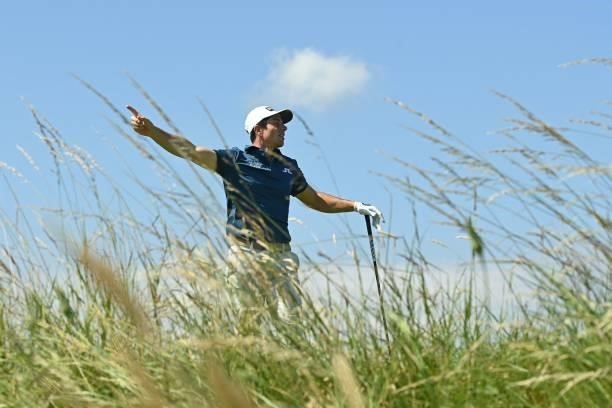 Norway's Viktor Hovland indicates a wayward shot from the13th tee during his first round on day one of The 149th British Open Golf Championship at...