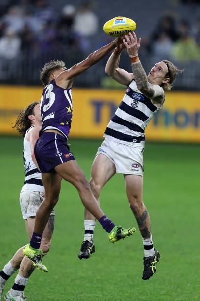 Liam Henry of the Dockers and Mark Blicavs of the Cats vie for the ball during the 2021 AFL Round 18 match between the Fremantle Dockers and the...