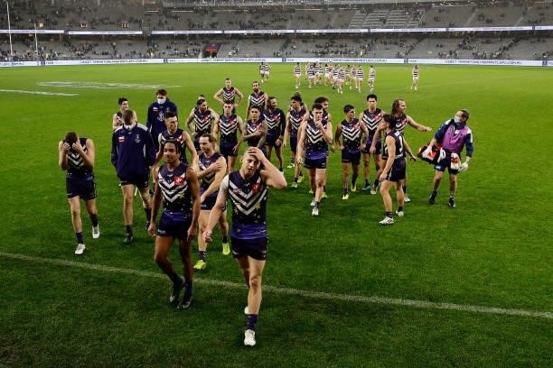 The Dockers leave the field after the teams defeat during the 2021 AFL Round 18 match between the Fremantle Dockers and the Geelong Cats at Optus...