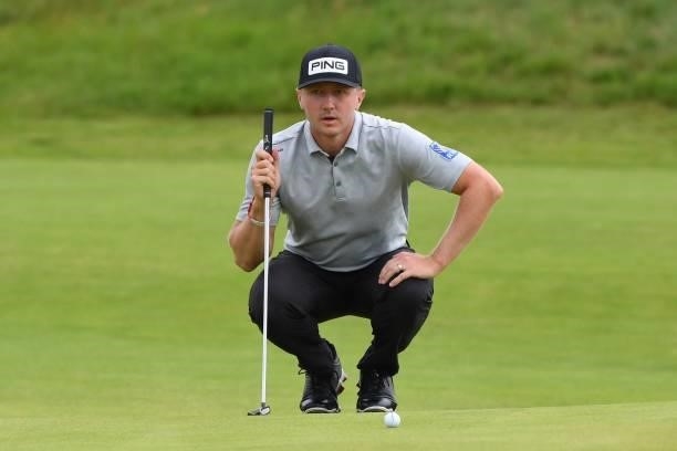 Canada's Mackenzie Hughes lines up a putt on the 8th green during his first round on day one of The 149th British Open Golf Championship at Royal St...