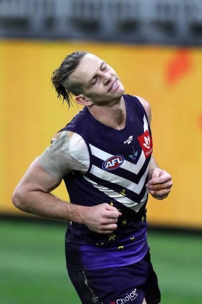 Nat Fyfe of the Dockers reacts after missing a shot on goal during the 2021 AFL Round 18 match between the Fremantle Dockers and the Geelong Cats at...