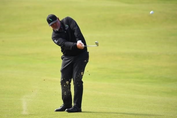 Northern Ireland's Darren Clarke plays his approach from the 6th fairway during his first round on day one of The 149th British Open Golf...