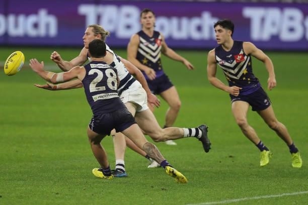 Mark Blicavs of the Cats handpasses the ball during the 2021 AFL Round 18 match between the Fremantle Dockers and the Geelong Cats at Optus Stadium...