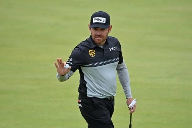 South Africa's Louis Oosthuizen reacts after making his birdie putt on the 16th green during his first round on day one of The 149th British Open...