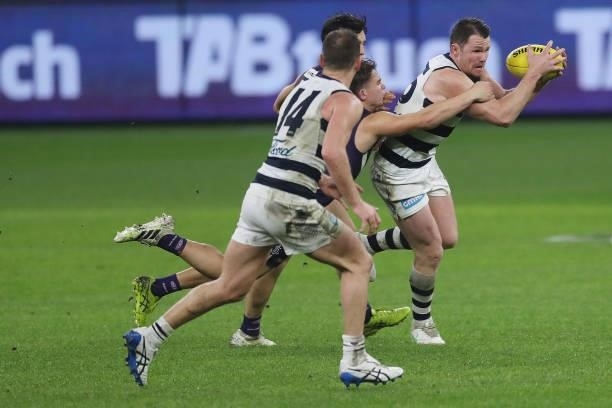Patrick Dangerfield of the Cats is tackled by Caleb Serong of the Dockers during the 2021 AFL Round 18 match between the Fremantle Dockers and the...