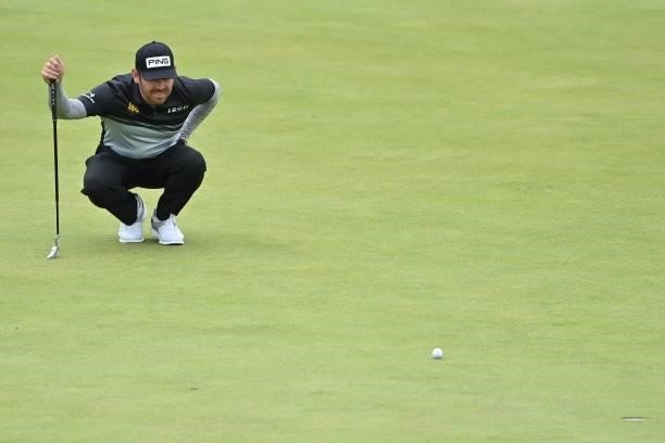 South Africa's Louis Oosthuizen lines up his birdie putt on the 16th green during his first round on day one of The 149th British Open Golf...