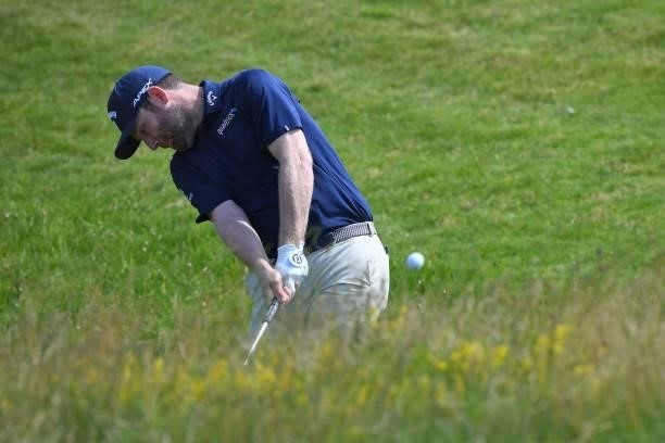 South Africa's Branden Grace plays from the rough on the 8th hole during his first round on day one of The 149th British Open Golf Championship at...