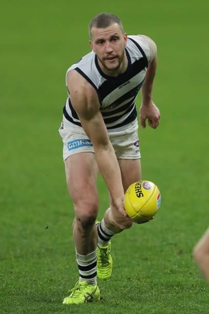 Sam Menegola of the Cats looks to pass the ball during the 2021 AFL Round 18 match between the Fremantle Dockers and the Geelong Cats at Optus...