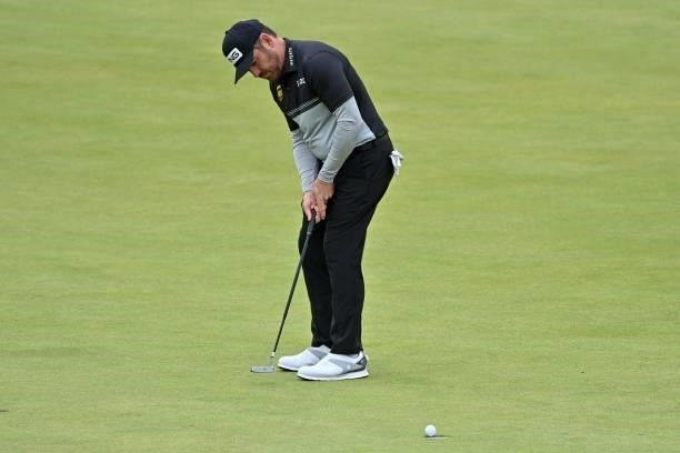 South Africa's Louis Oosthuizen making his birdie putt on the 16th green during his first round on day one of The 149th British Open Golf...