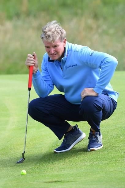 South Africa's Ernie Els lines up his putt on the 6th green during his first round on day one of The 149th British Open Golf Championship at Royal St...