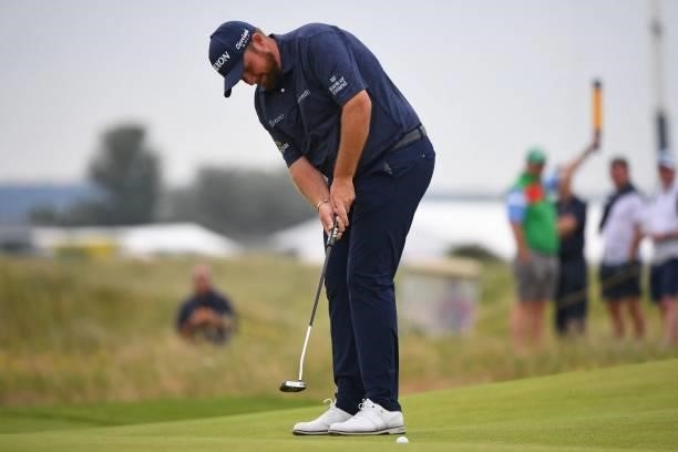 Ireland's Shane Lowry putts on the 9th green during his first round on day one of The 149th British Open Golf Championship at Royal St George's,...