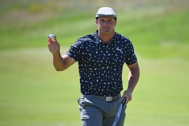 Golfer Bryson DeChambeau reacts after making his birdie putt on the 7th green during his first round on day one of The 149th British Open Golf...