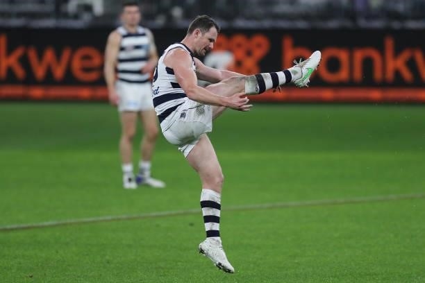Patrick Dangerfield of the Cats kicks on goal during the 2021 AFL Round 18 match between the Fremantle Dockers and the Geelong Cats at Optus Stadium...