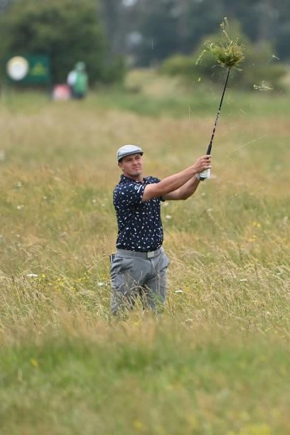 Golfer Bryson DeChambeau plays from the deep rough on the 15th hole during his first round on day one of The 149th British Open Golf Championship at...
