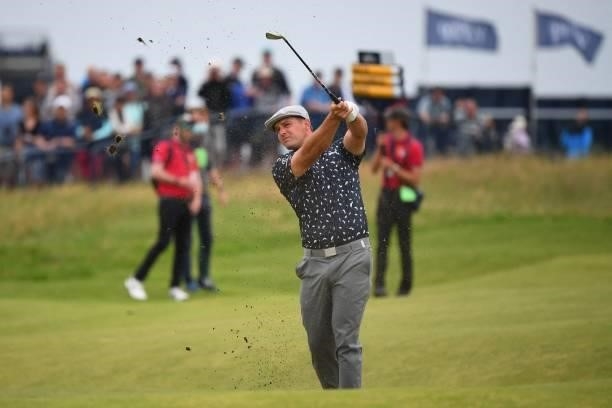 Golfer Bryson DeChambeau plays his approach shot from the 18th fairway during his first round on day one of The 149th British Open Golf Championship...