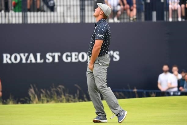 Golfer Bryson DeChambeau reacts to missing a putt on the 18th green during his first round on day one of The 149th British Open Golf Championship at...