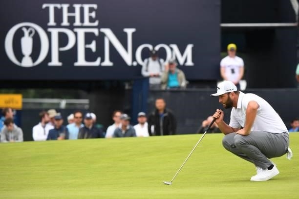 Spain's Jon Rahm lines up a putt on the 18th green during his first round on day one of The 149th British Open Golf Championship at Royal St...