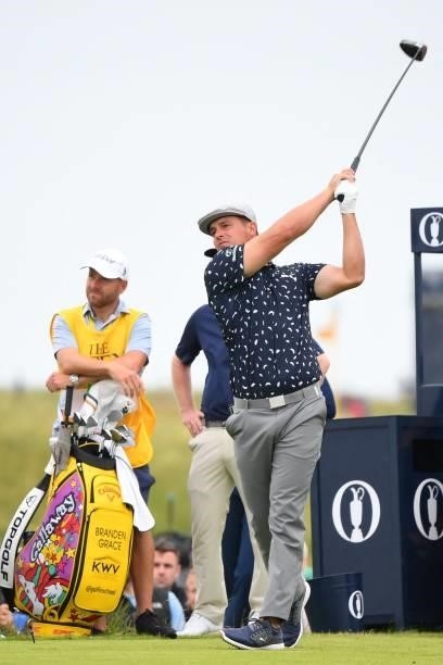 Golfer Bryson DeChambeau watches his drive from the 18th tee during his first round on day one of The 149th British Open Golf Championship at Royal...