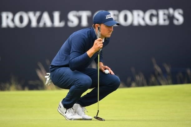 Golfer Jordan Spieth wait to putt on the 18th green during his first round on day one of The 149th British Open Golf Championship at Royal St...