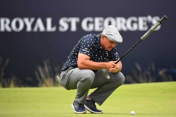 Golfer Bryson DeChambeau waits to putt on the 18th green during his first round on day one of The 149th British Open Golf Championship at Royal St...