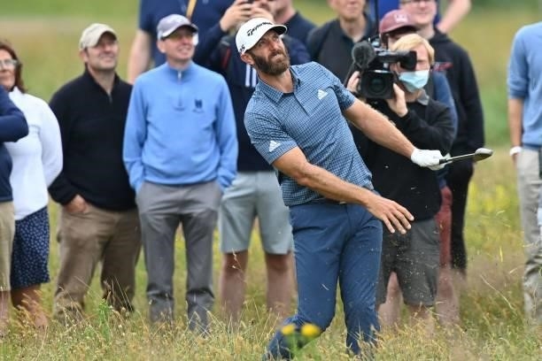 Golfer Dustin Johnson plays out of the rough of the 15th hole during his first round on day one of The 149th British Open Golf Championship at Royal...