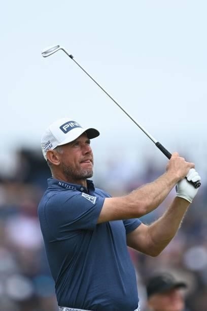 England's Lee Westwood watches his iron shot from the 16th tee during his first round on day one of The 149th British Open Golf Championship at Royal...