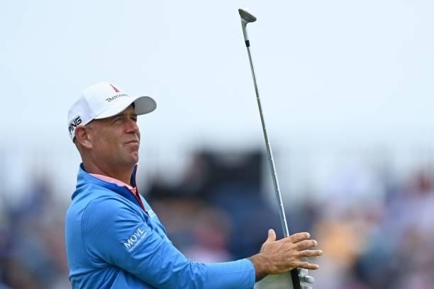Golfer Stewart Cink watches his iron shot from the 16th tee during his first round on day one of The 149th British Open Golf Championship at Royal St...