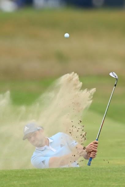 Spain's Sergio Garcia plays from a bunker on the 15th hole during his first round on day one of The 149th British Open Golf Championship at Royal St...