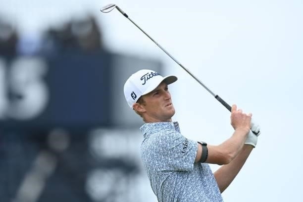 Golfer Will Zalatoris watches his iron shot from the 16th tee during his first round on day one of The 149th British Open Golf Championship at Royal...