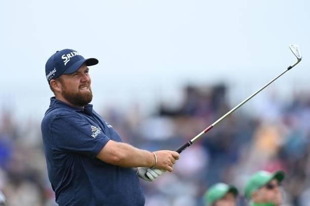 Ireland's Shane Lowry watches his iron shot from the 16th tee during his first round on day one of The 149th British Open Golf Championship at Royal...