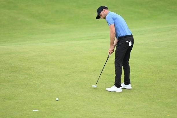 Germany's Marcel Schneider putts on the 15th green during his first round on day one of The 149th British Open Golf Championship at Royal St...