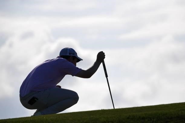 Scotland's Robert MacIntyre lines up a putt during his first round on day one of The 149th British Open Golf Championship at Royal St George's,...