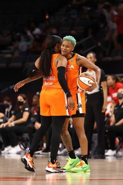 Courtney Williams hugs Arike Ogunbowale of Team WNBA after the AT&T WNBA All-Star Game 2021 on July 14, 2021 at Michelob ULTRA Arena in Las Vegas,...